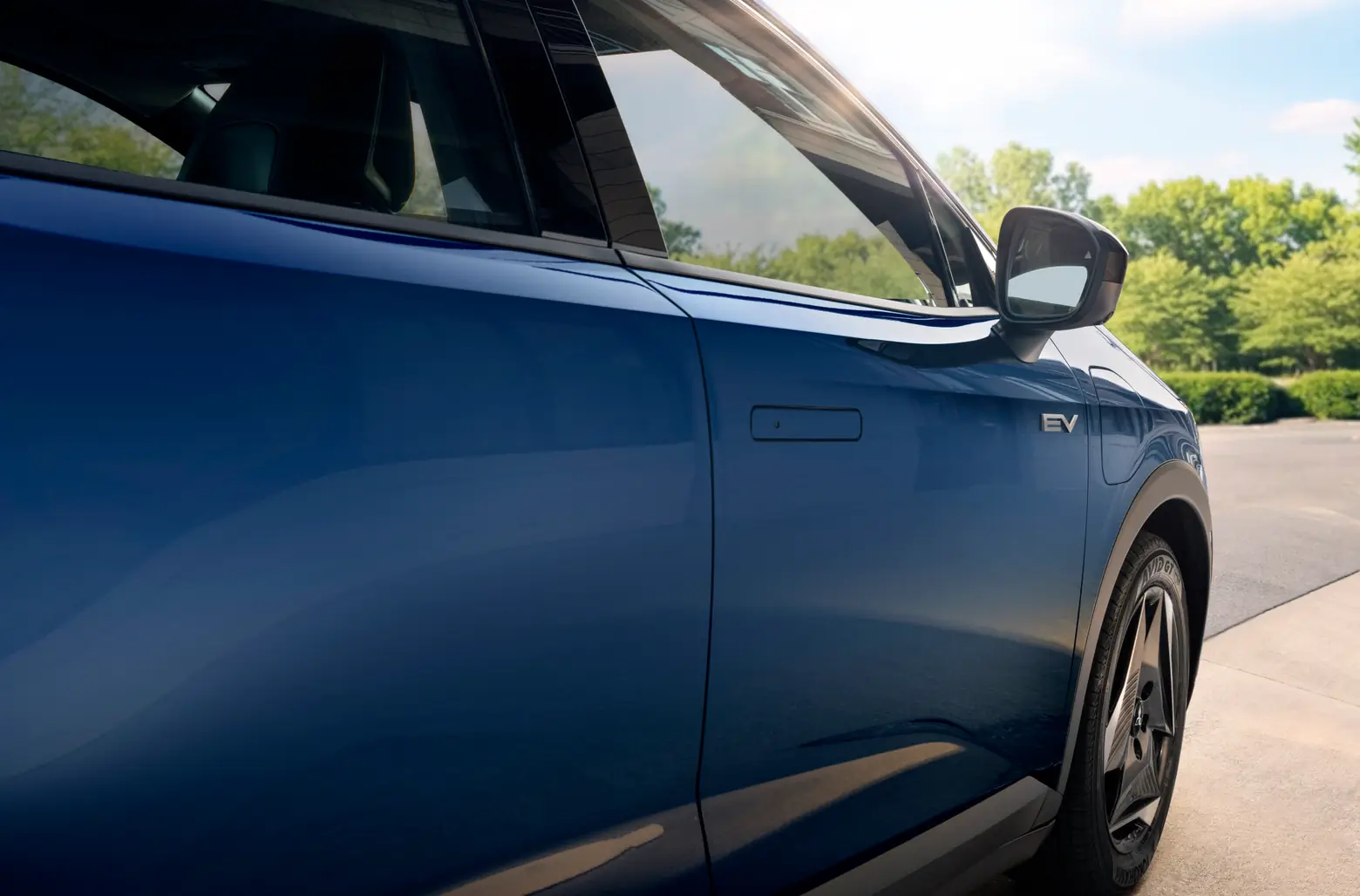 Exterior of a blue 2027 Eclipse Sportback EV on the passenger's side